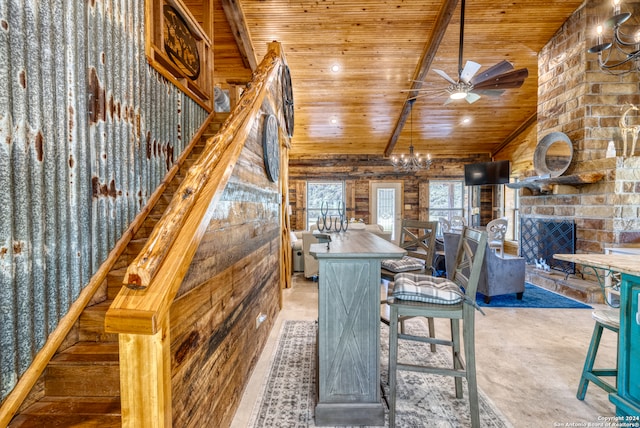 dining room with ceiling fan with notable chandelier, wood ceiling, high vaulted ceiling, and concrete floors