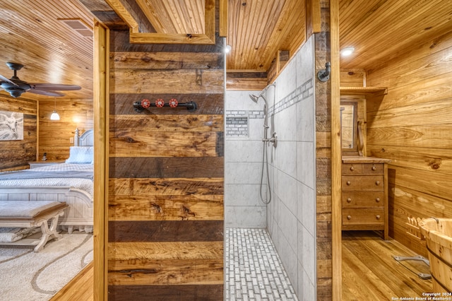 bathroom featuring wooden ceiling, walk in shower, ceiling fan, and wooden walls