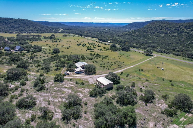 birds eye view of property with a rural view and a mountain view