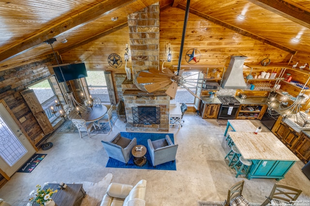 living room featuring a fireplace, high vaulted ceiling, and ceiling fan