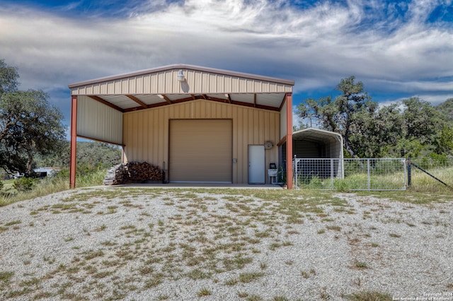 garage featuring a carport