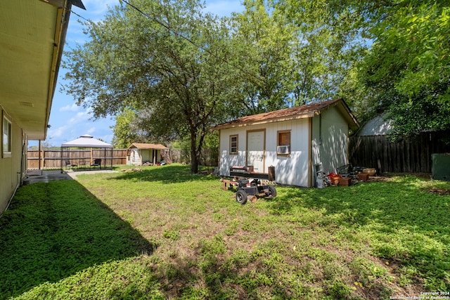 view of yard featuring a storage unit