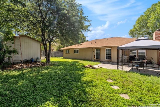 view of yard featuring a patio and a gazebo