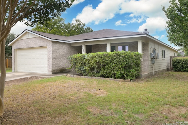 view of front of house with a garage and a front lawn