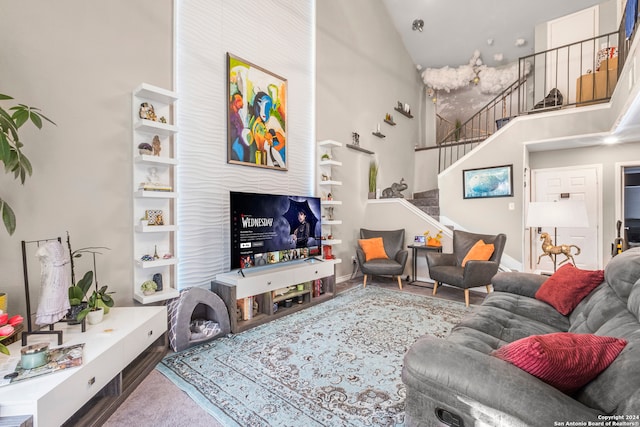 living room with high vaulted ceiling