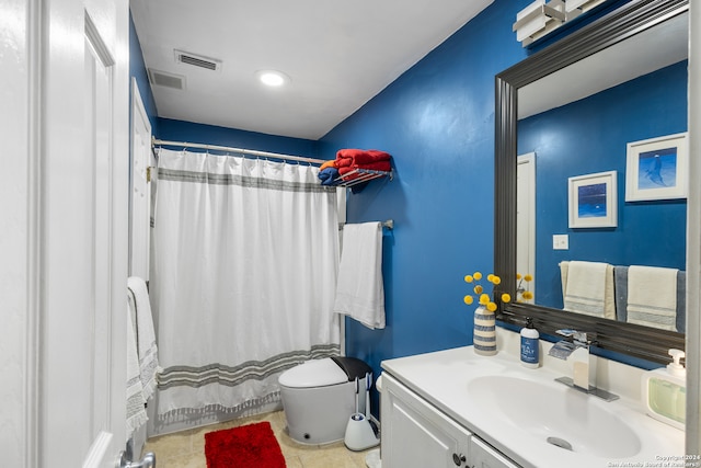 bathroom with tile patterned flooring, vanity, toilet, and a shower with shower curtain