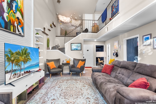 living room featuring a high ceiling