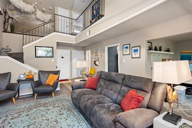 12019 Ashrock Ct, San Antonio, TX 78230 - living room featuring stairs, visible vents, and a high ceiling