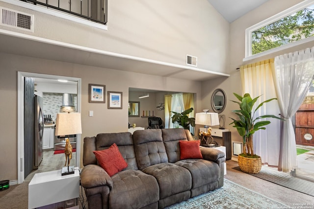 12019 Ashrock Ct, San Antonio, TX 78230 - carpeted living room featuring a high ceiling and visible vents