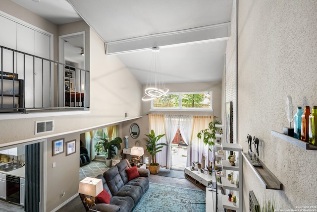 interior space with a notable chandelier and lofted ceiling with beams