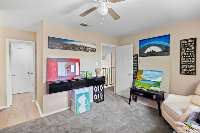 rec room featuring ceiling fan and light colored carpet