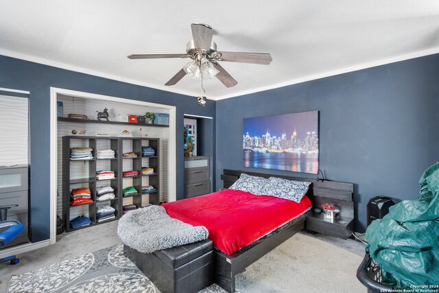 carpeted bedroom with ceiling fan