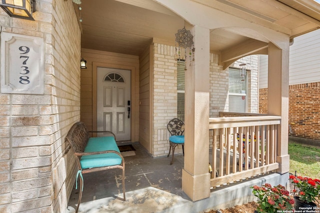 entrance to property featuring a porch