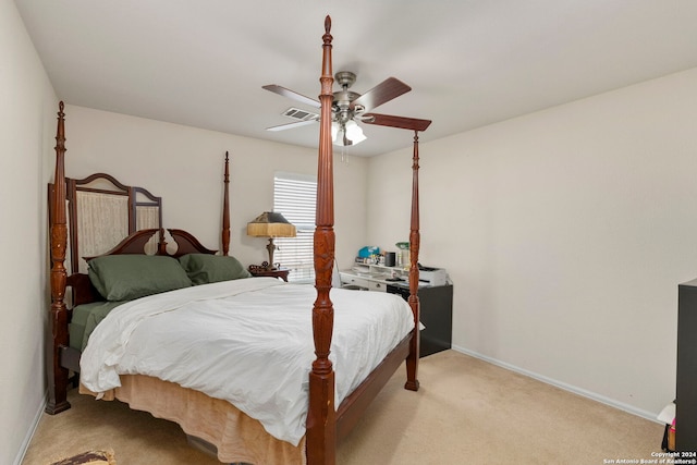 bedroom with ceiling fan and light colored carpet