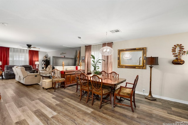 dining area featuring hardwood / wood-style floors and ceiling fan