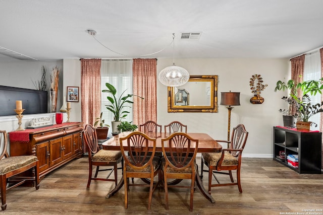 dining room featuring dark hardwood / wood-style flooring