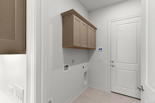 clothes washing area featuring washer hookup, cabinet space, light tile patterned floors, baseboards, and hookup for an electric dryer