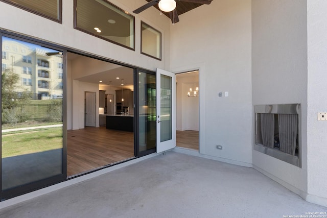 view of patio featuring ceiling fan