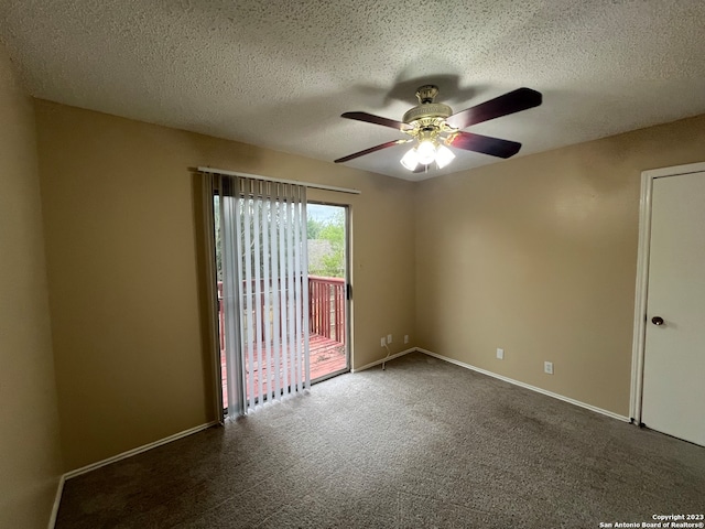 carpeted empty room featuring a textured ceiling and ceiling fan