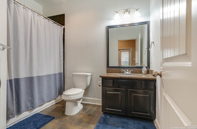 bathroom featuring tile patterned floors, a shower with curtain, vanity, and toilet