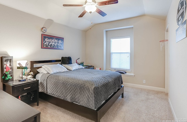 carpeted bedroom featuring vaulted ceiling and ceiling fan