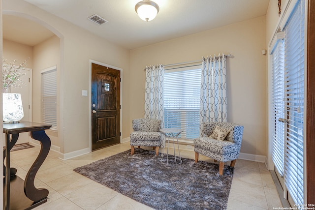 sitting room with light tile patterned floors