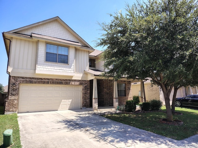 craftsman inspired home with a front yard, an attached garage, brick siding, and driveway