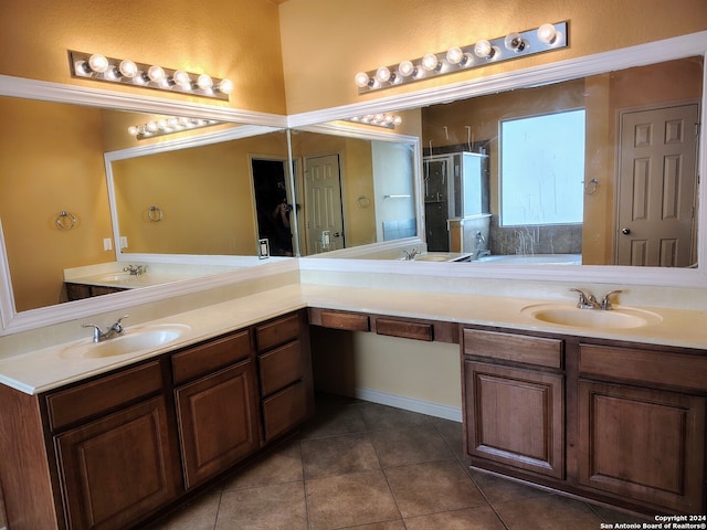 bathroom featuring tile patterned flooring, vanity, and a shower with shower door