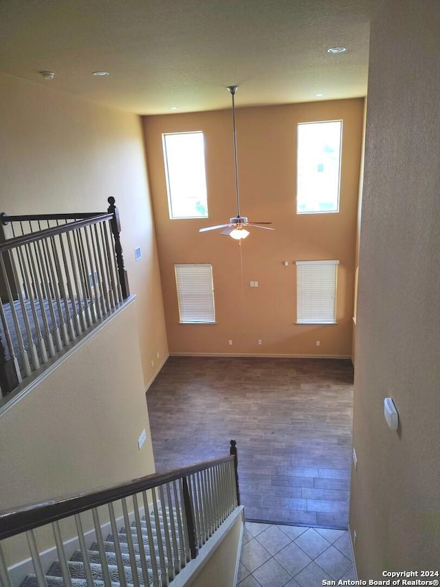 interior space featuring a wealth of natural light, ceiling fan, and hardwood / wood-style flooring