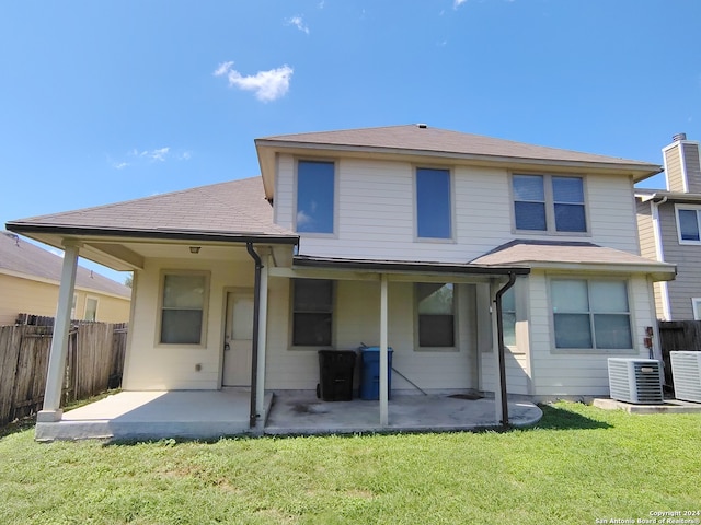 back of house featuring a yard, a patio, and central AC unit