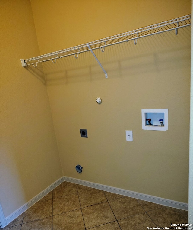 clothes washing area featuring gas dryer hookup, hookup for a washing machine, tile patterned flooring, and hookup for an electric dryer