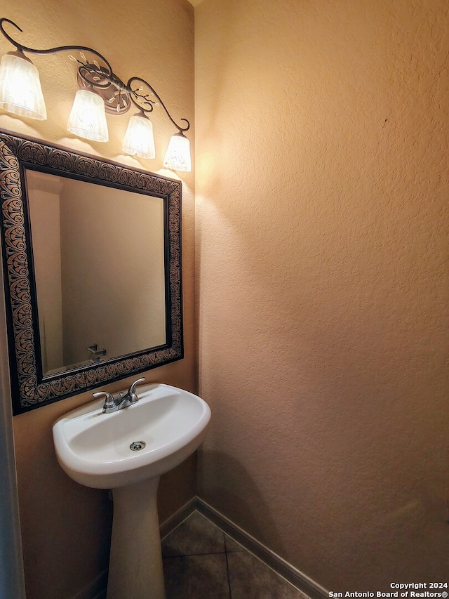 bathroom with tile patterned floors and sink