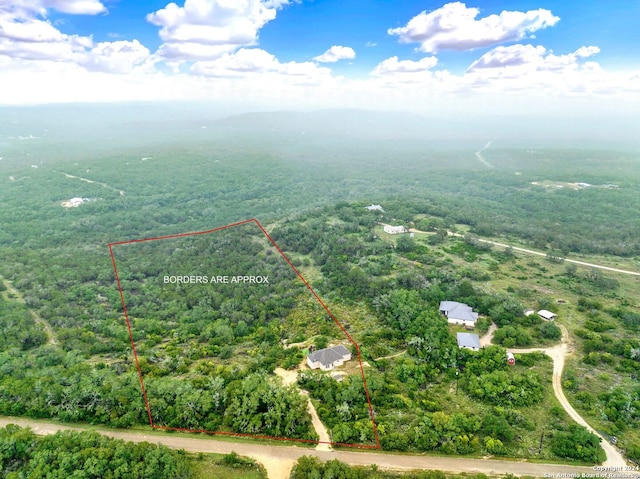 drone / aerial view with a view of trees