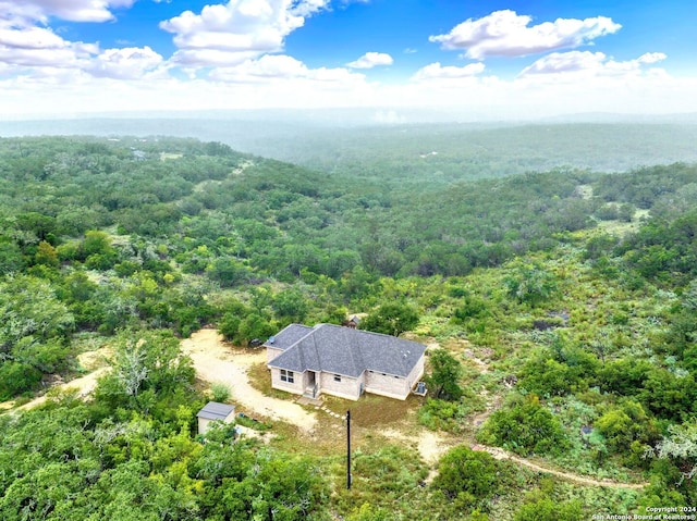 aerial view featuring a view of trees