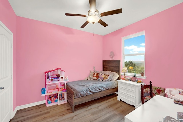 bedroom featuring ceiling fan and light hardwood / wood-style floors