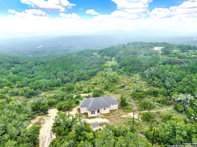 aerial view featuring a wooded view