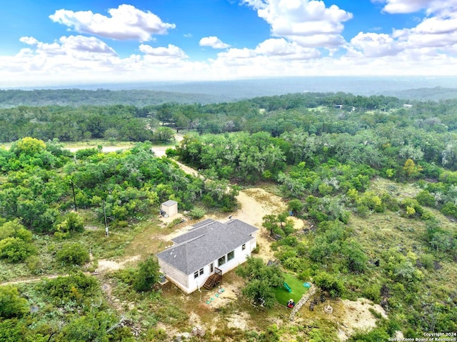 drone / aerial view with a view of trees