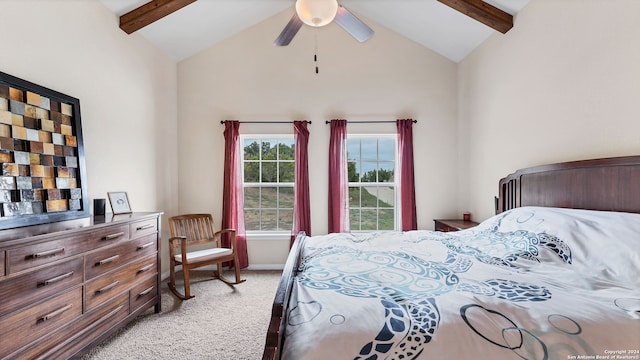 carpeted bedroom with ceiling fan and lofted ceiling with beams