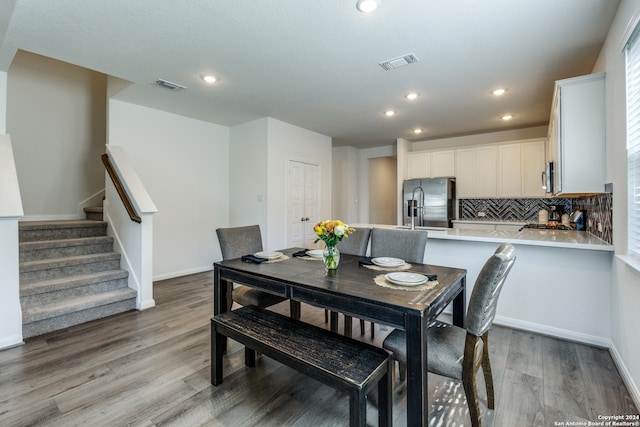 dining area with light hardwood / wood-style flooring