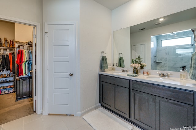 bathroom with vanity, tile patterned floors, and walk in shower