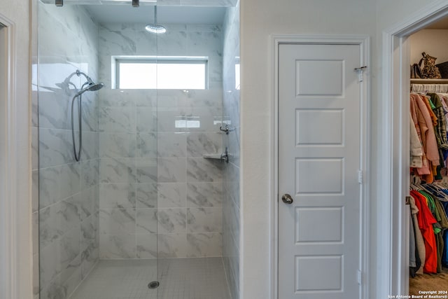 bathroom with tiled shower