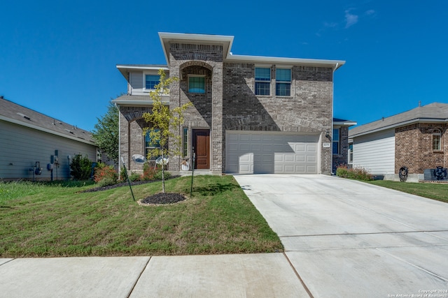 view of front facade featuring a garage and a front lawn