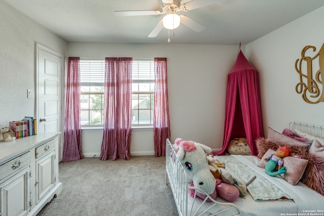 bedroom with light colored carpet and ceiling fan