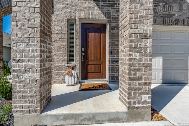 property entrance with a garage