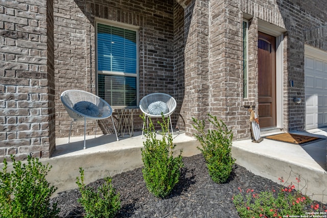 doorway to property featuring a garage