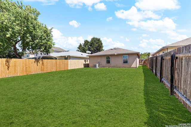 view of yard featuring central AC unit