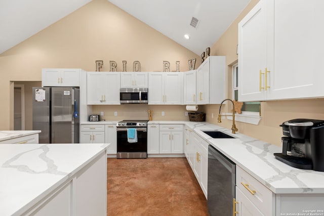 kitchen with stainless steel appliances, sink, high vaulted ceiling, white cabinetry, and light stone counters