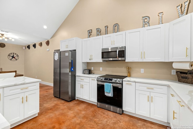 kitchen with lofted ceiling, stainless steel appliances, light stone countertops, and white cabinets