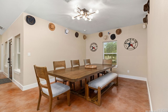 dining area featuring an inviting chandelier