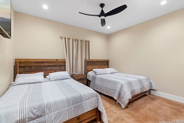 bedroom with ceiling fan and light carpet